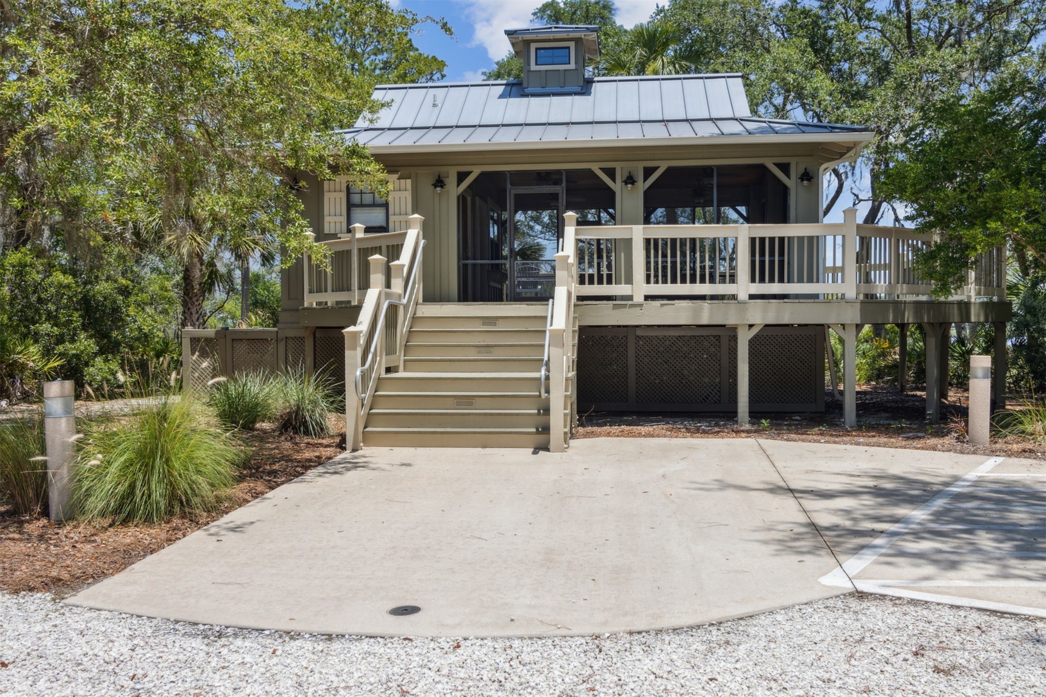 96029 Brady Point Road Fernandina Beach, FL 32034 - Photo 55 of 61 a front view of a house with garden