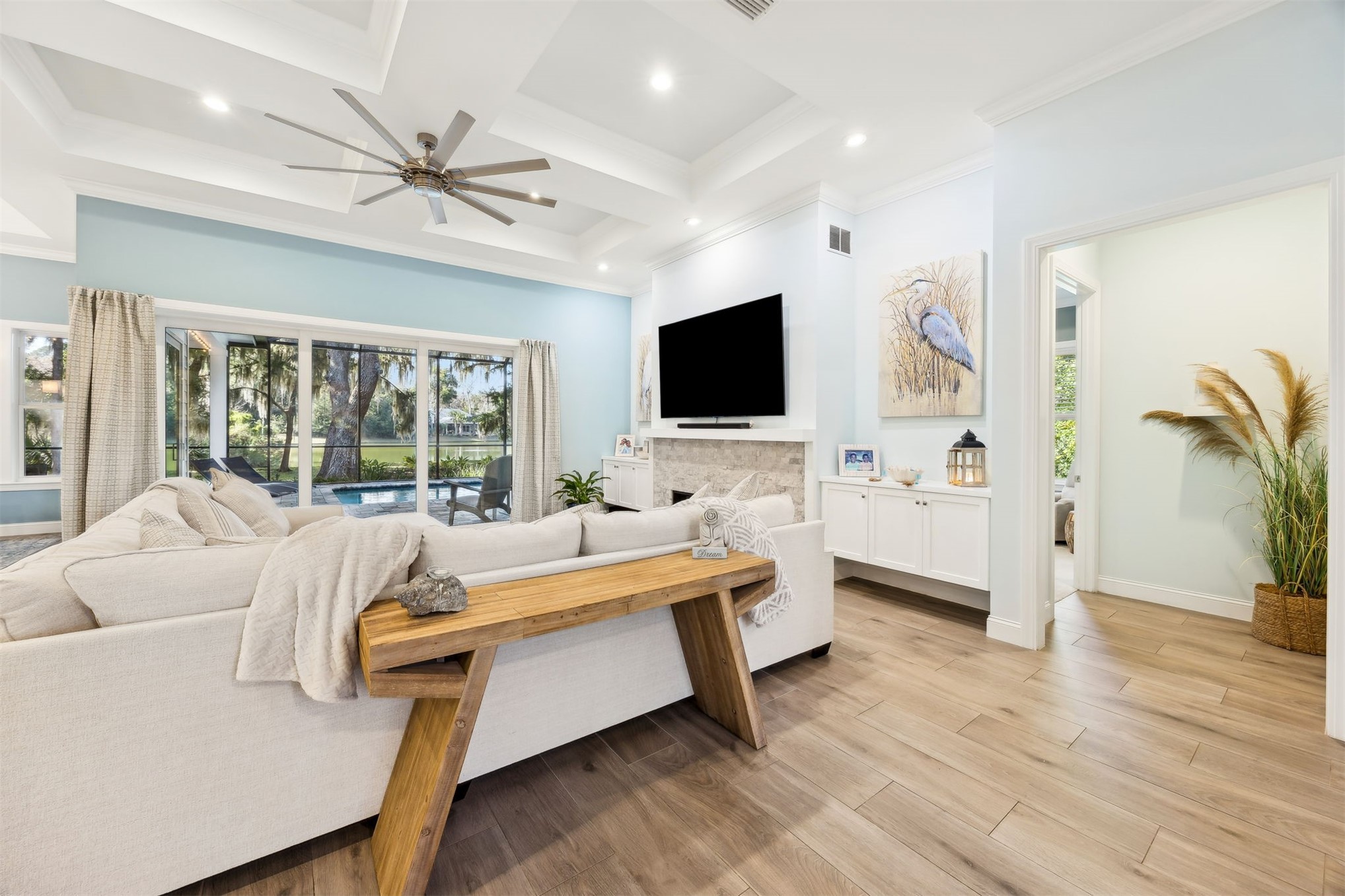 96029 Brady Point Road Fernandina Beach, FL 32034 - Photo 6 of 61 a living room with furniture and a flat screen tv