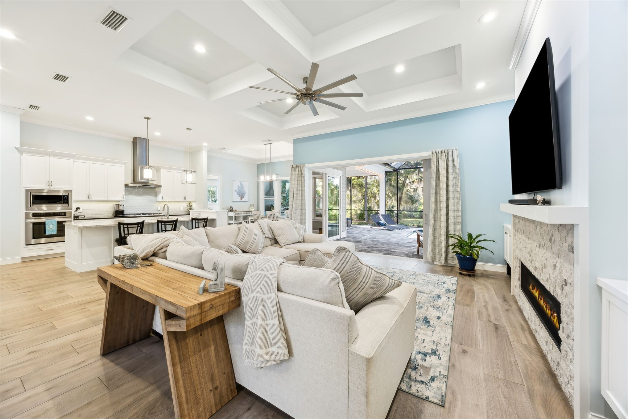 96029 Brady Point Road Fernandina Beach, FL 32034 - Photo 8 of 61 a living room with fireplace furniture and a flat screen tv