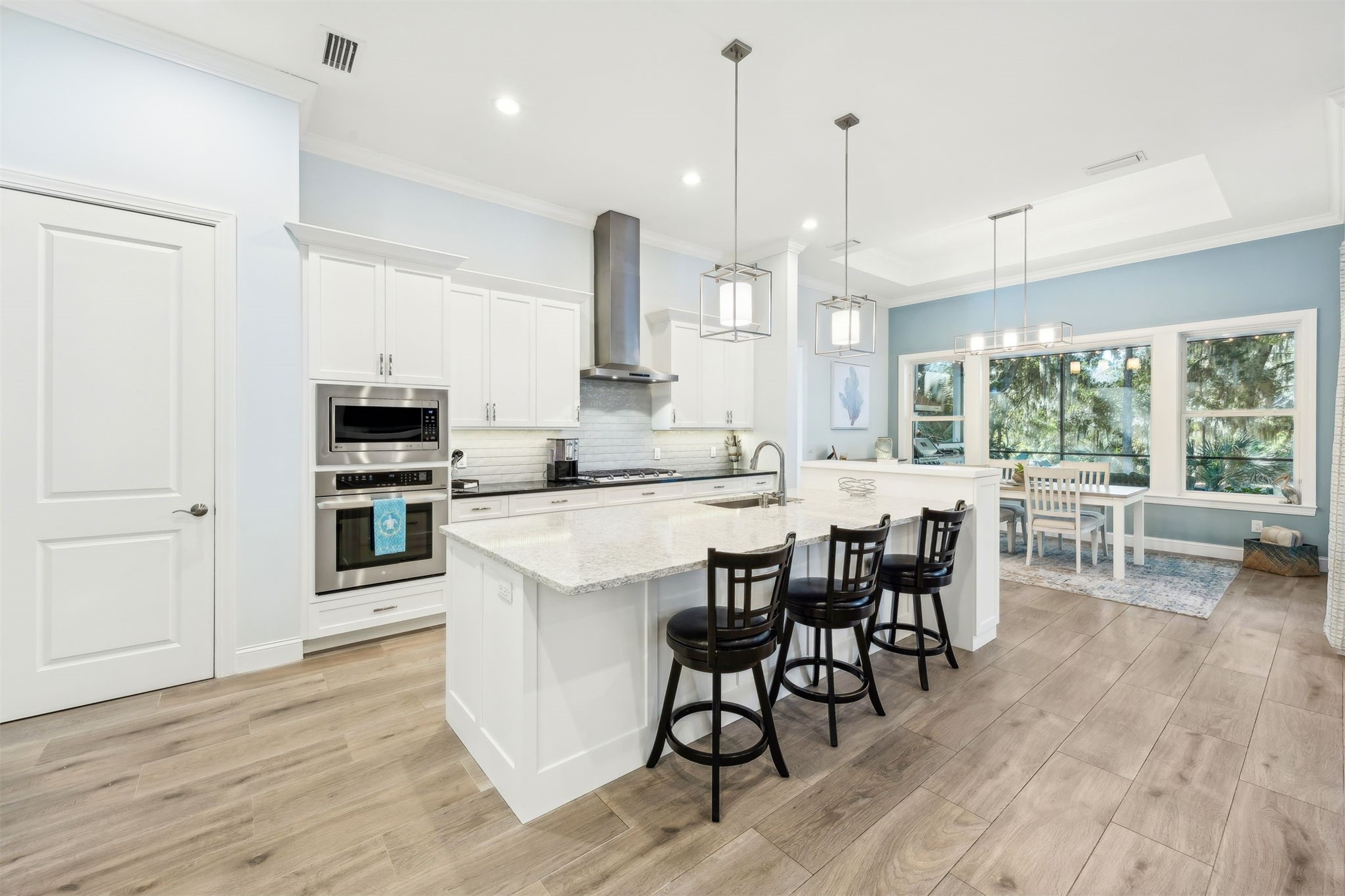 96029 Brady Point Road Fernandina Beach, FL 32034 - Photo 9 of 61 a large kitchen with a table and chairs