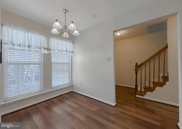 a view of a livingroom with wooden floor