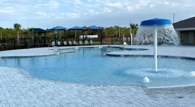 an aerial view of a residential houses with outdoor space