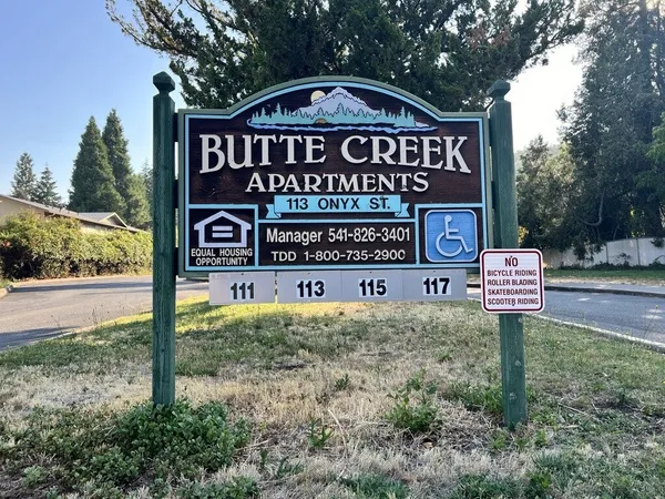 a sign board on the side of a road