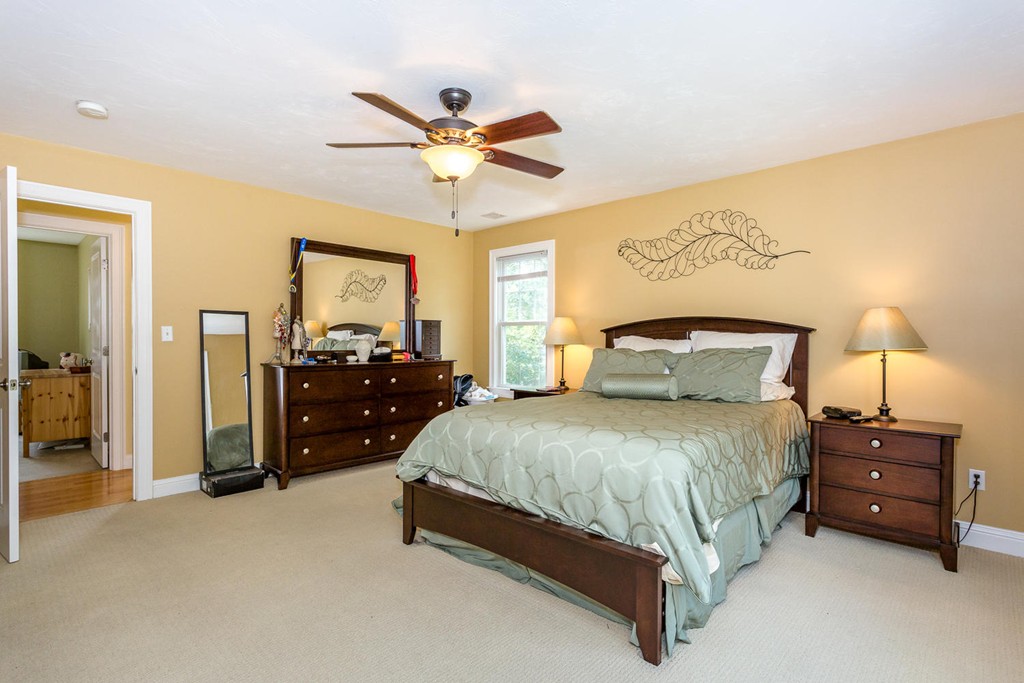 17 Endicott Street, Unit 17 Canton, MA 02021 - Photo 11 of 18 a bedroom with a bed and a chandelier