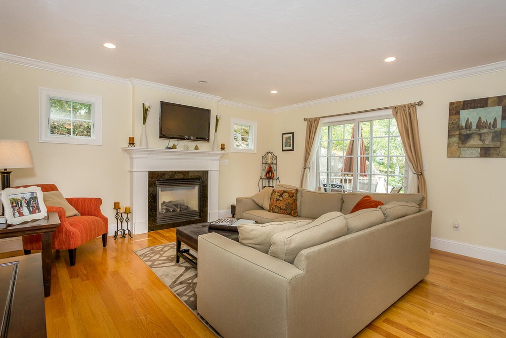 17 Endicott Street, Unit 17 Canton, MA 02021 - Photo 3 of 18 a living room with furniture fireplace and a flat screen tv