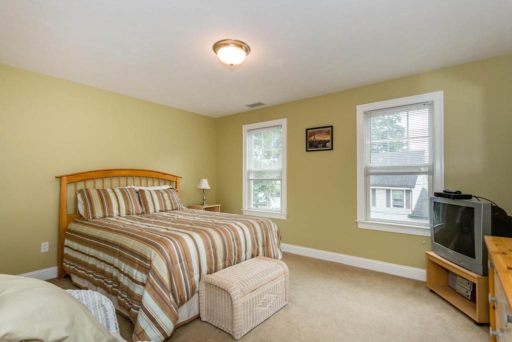 17 Endicott Street, Unit 17 Canton, MA 02021 - Photo 8 of 18 a bedroom with a bed and a window