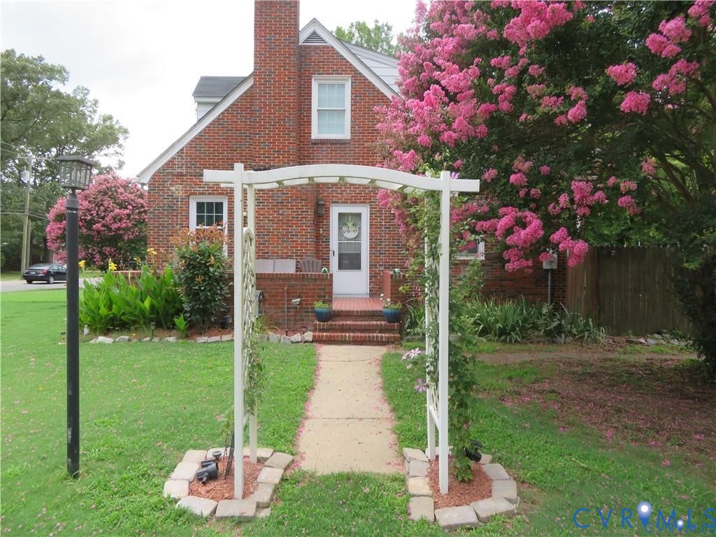 a front view of a house with garden