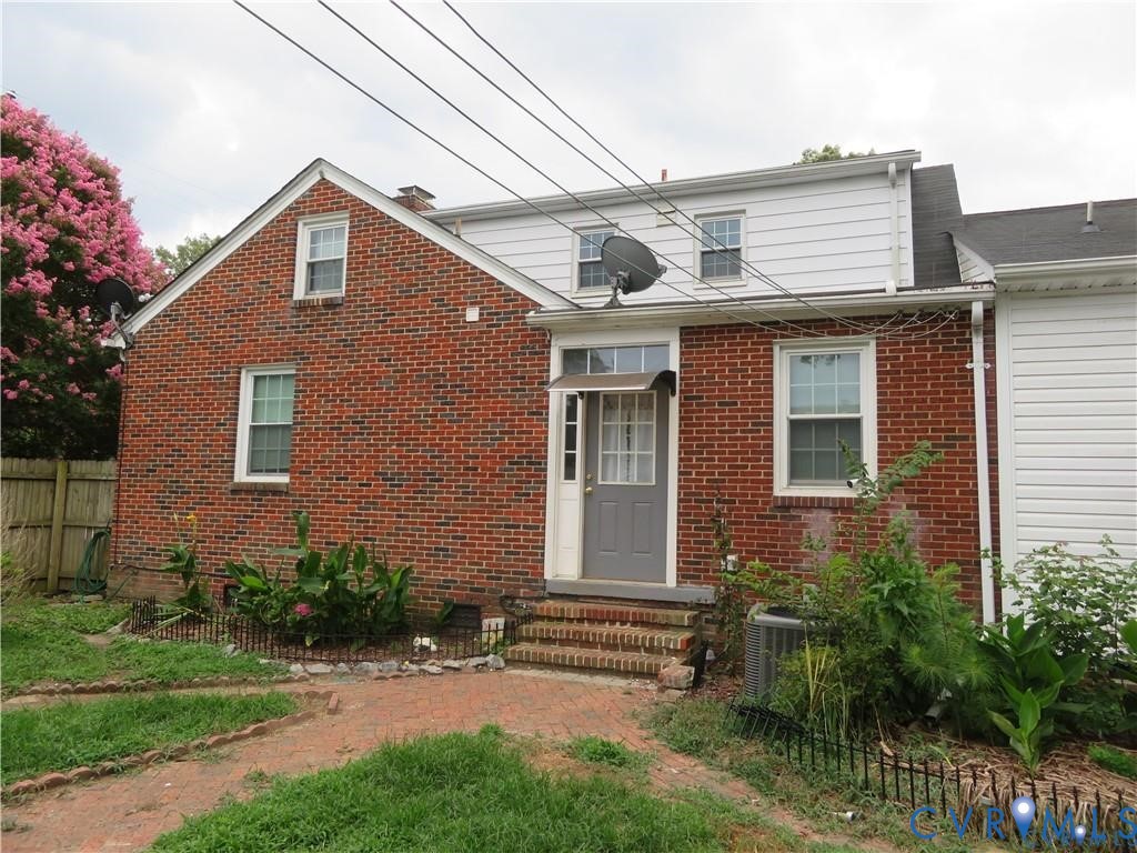 5900 River Road Petersburg, VA 23803 - Photo 12 of 44 a front view of a house with a yard