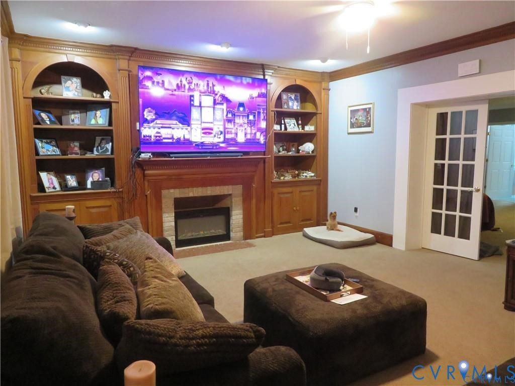 5900 River Road Petersburg, VA 23803 - Photo 19 of 44 a living room with furniture and a fireplace