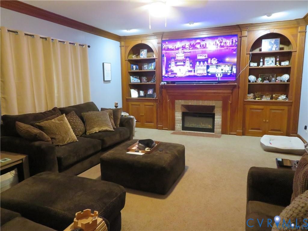 5900 River Road Petersburg, VA 23803 - Photo 22 of 44 a living room with furniture and a fireplace