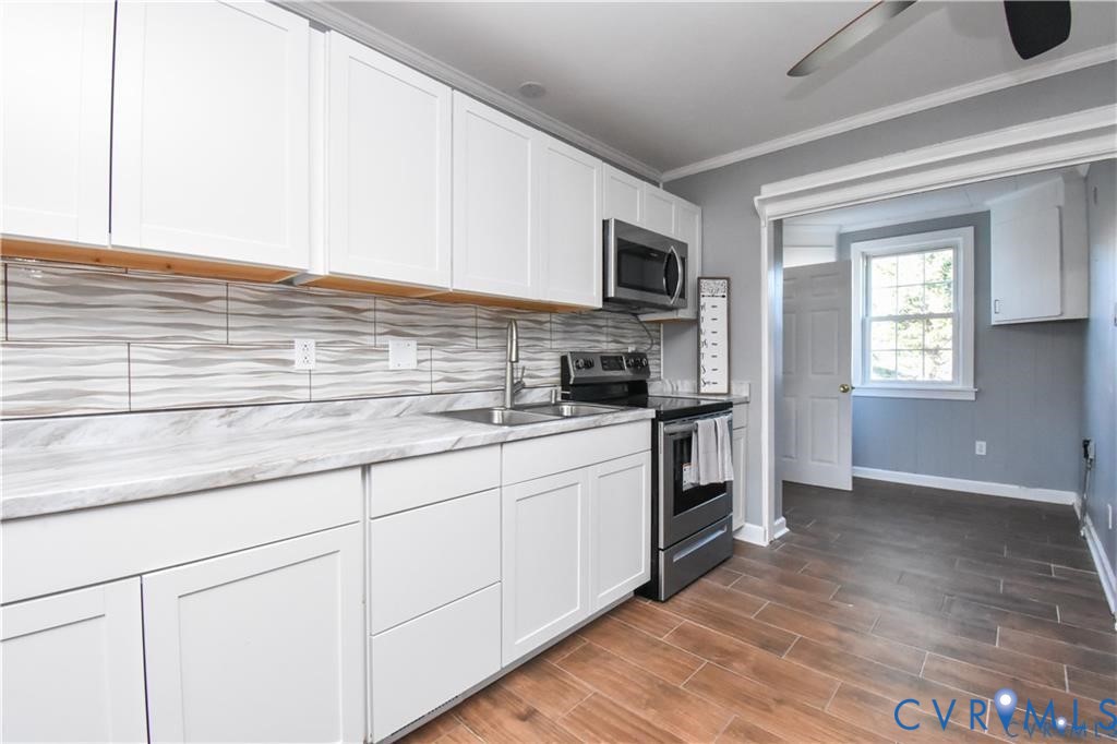 5900 River Road Petersburg, VA 23803 - Photo 25 of 44 a kitchen with stainless steel appliances granite countertop a sink and a stove