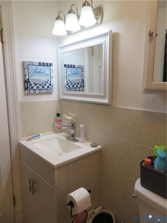 5900 River Road Petersburg, VA 23803 - Photo 30 of 44 a bathroom with a sink mirror and vanity