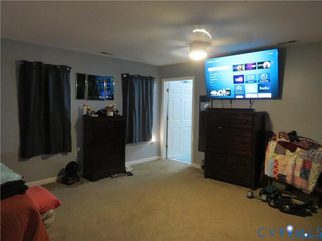 5900 River Road Petersburg, VA 23803 - Photo 34 of 44 a room with furniture and a flat screen tv