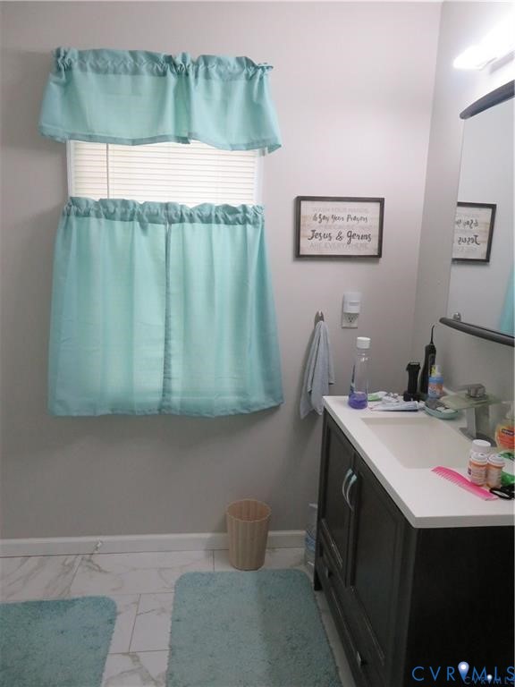 5900 River Road Petersburg, VA 23803 - Photo 36 of 44 a bathroom with a sink toilet and vanity