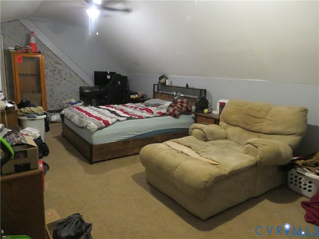 5900 River Road Petersburg, VA 23803 - Photo 41 of 44 a living room with furniture and a flat screen tv