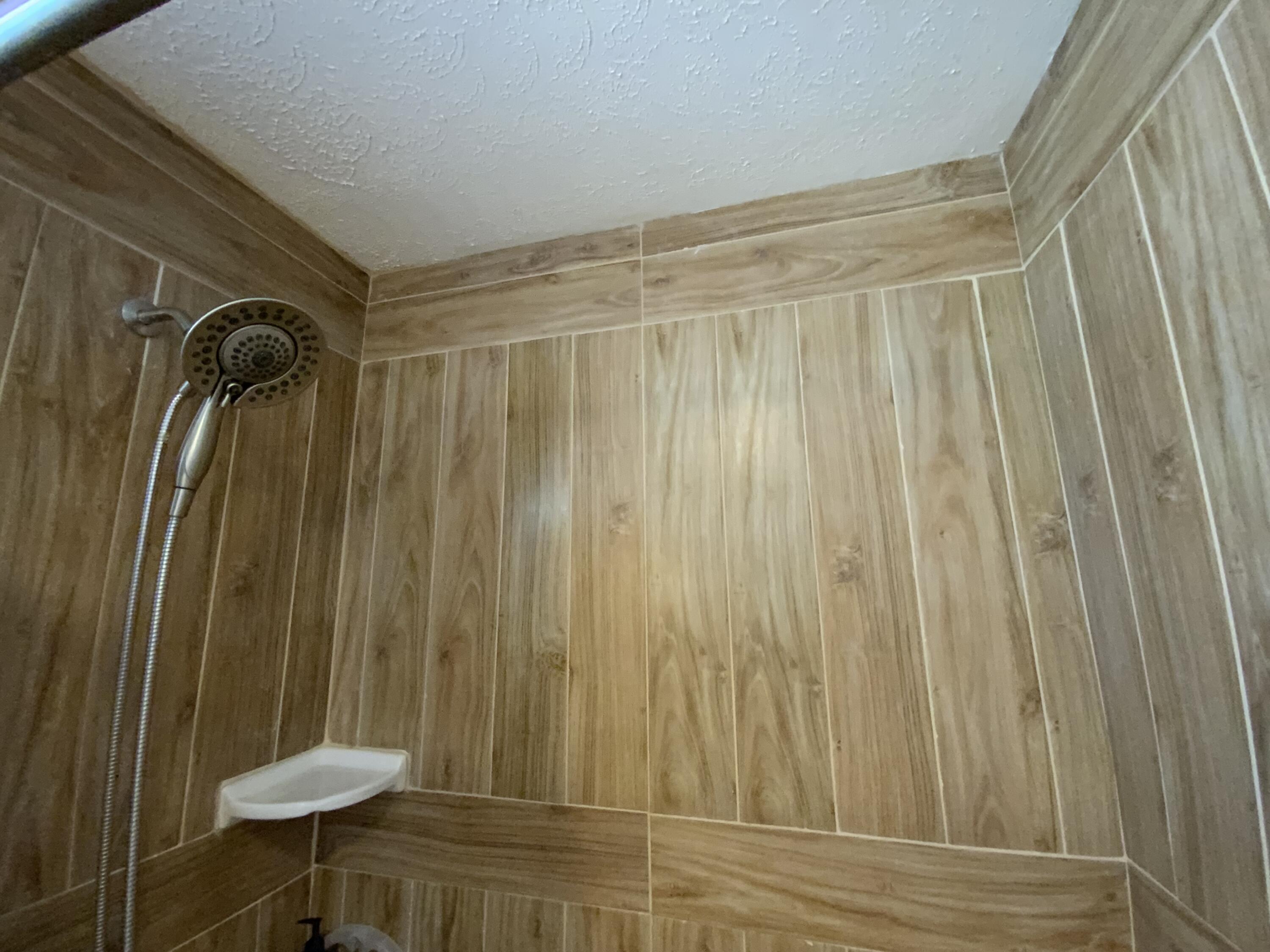 1095 Chobee Loop Okeechobee, FL 34974 - Photo 14 of 46 a bathroom with a shower curtain and a sink