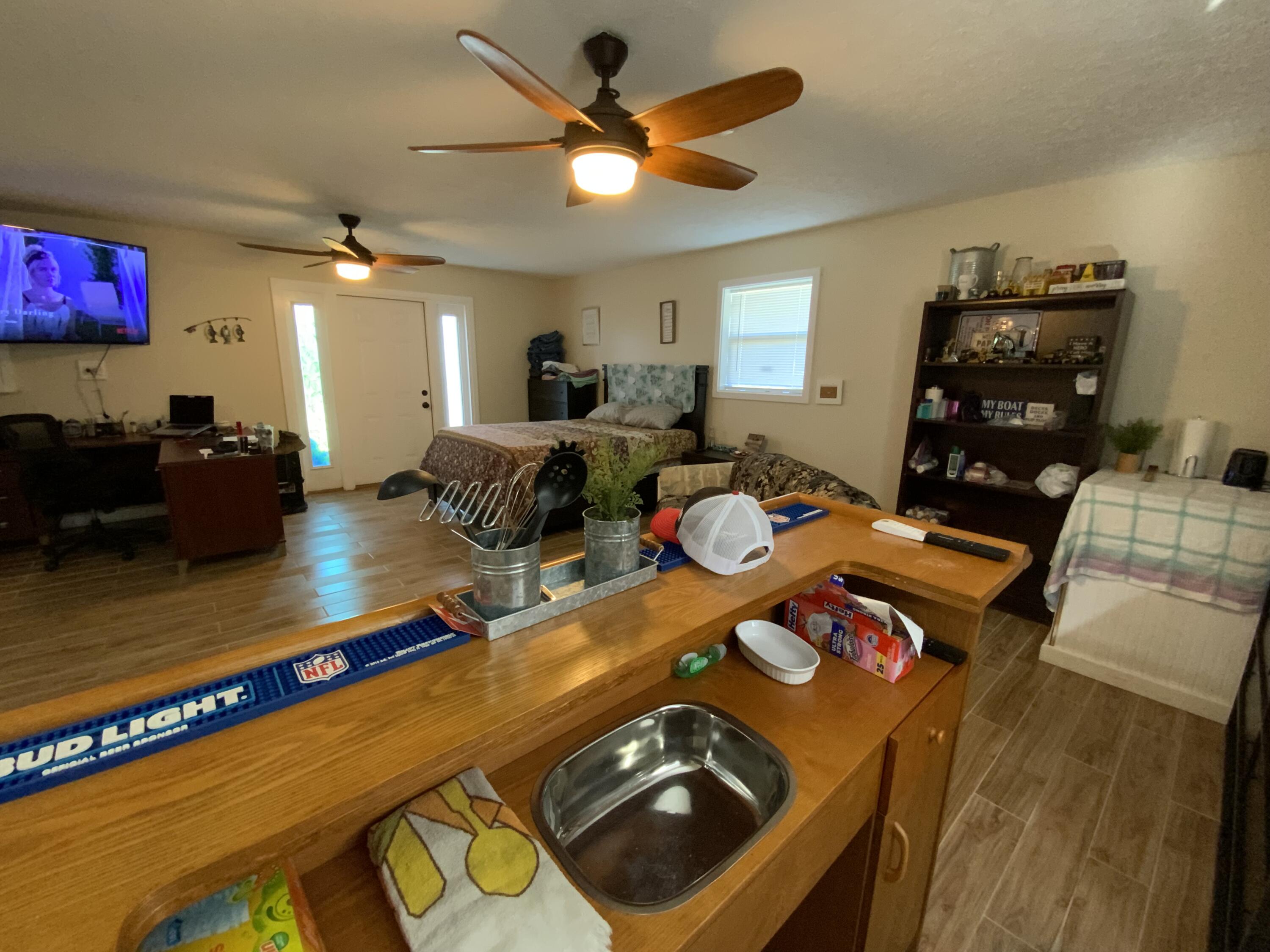 1095 Chobee Loop Okeechobee, FL 34974 - Photo 16 of 46 a living room with furniture and a flat screen tv