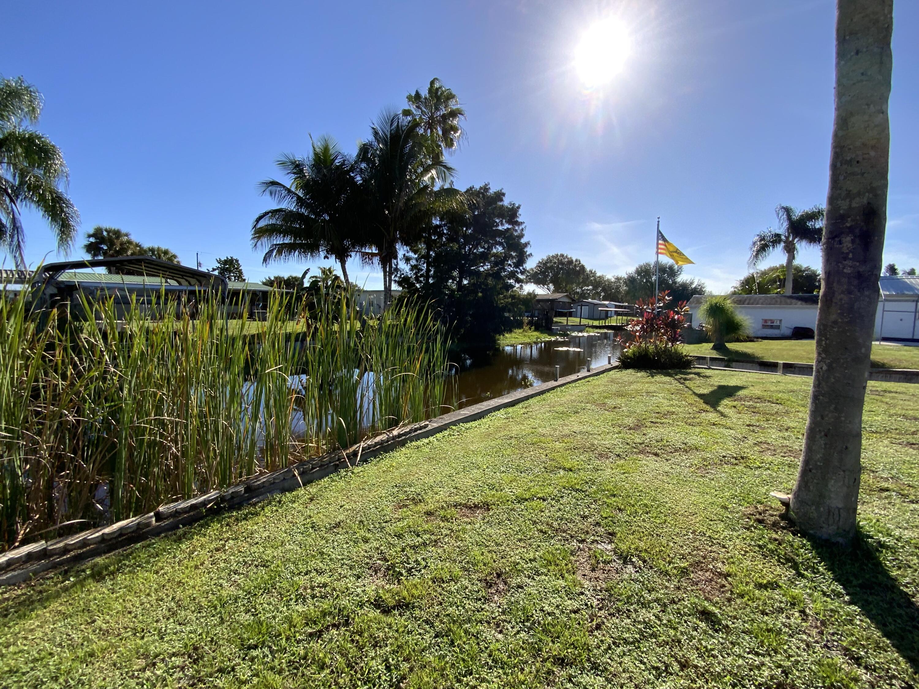 1095 Chobee Loop Okeechobee, FL 34974 - Photo 21 of 46 a view of a yard with an outdoor space