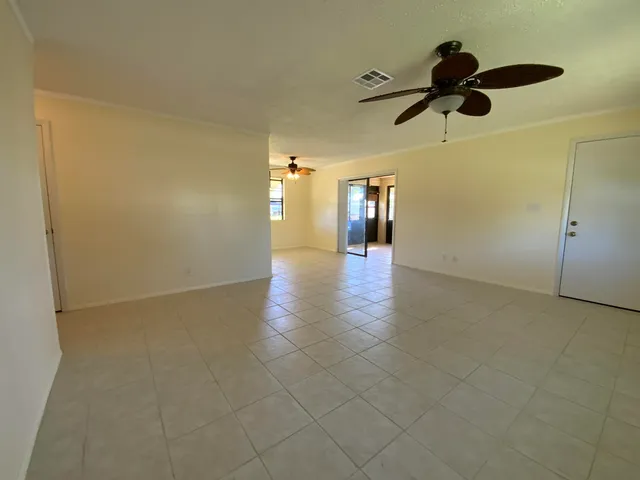 a open kitchen with cabinets and stainless steel appliances