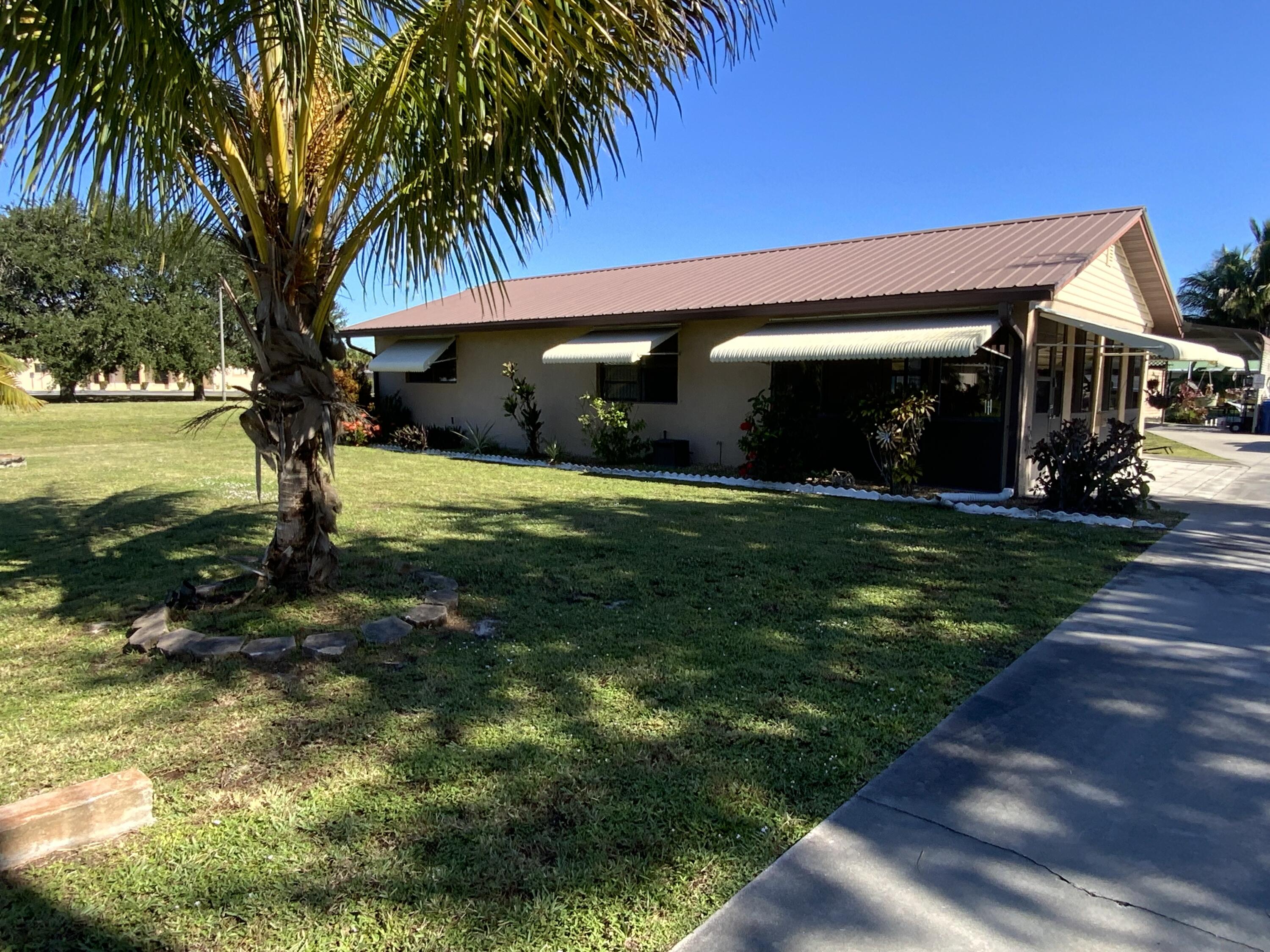 1095 Chobee Loop Okeechobee, FL 34974 - Photo 4 of 46 a view of a house with a yard