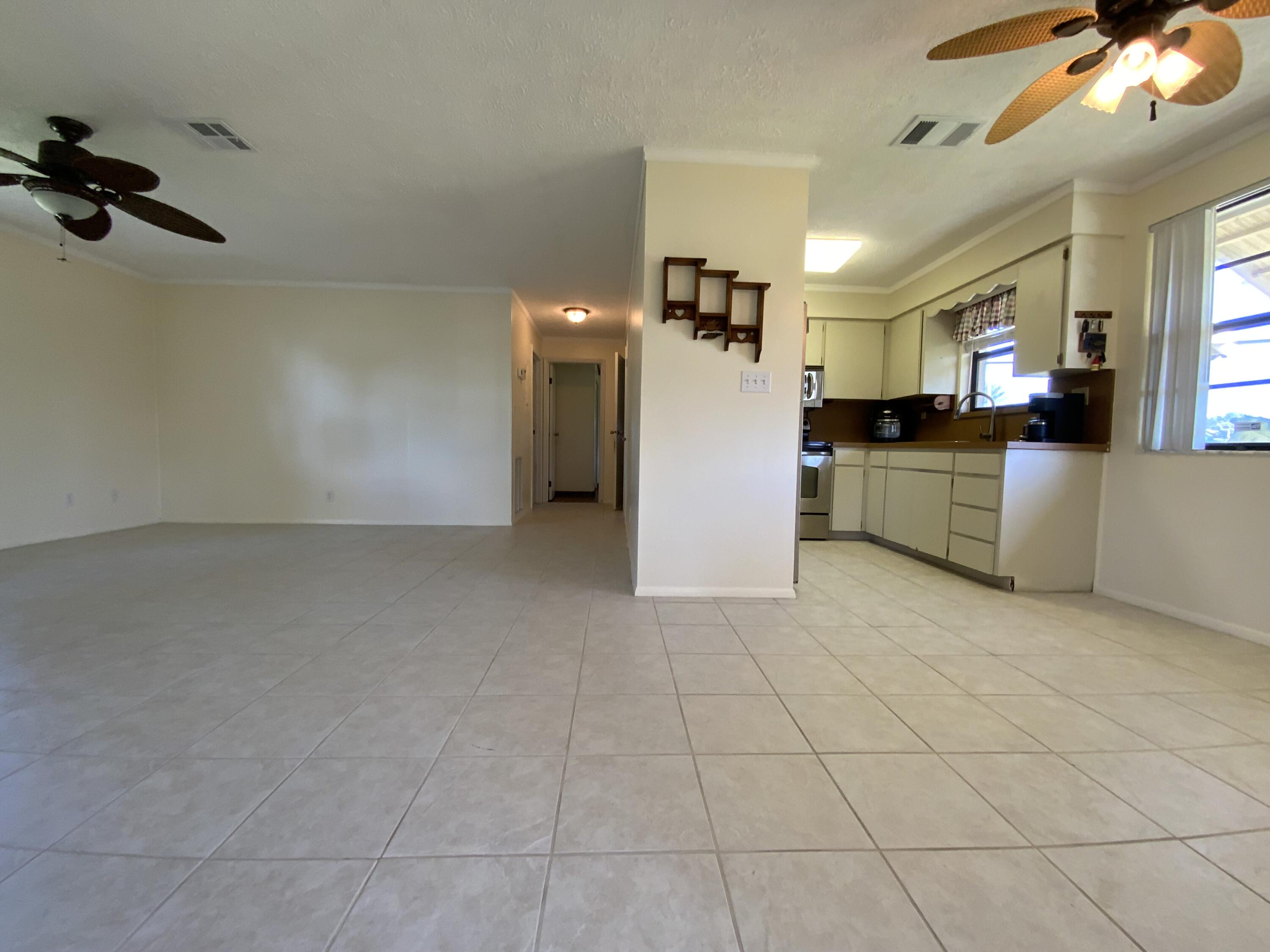 1095 Chobee Loop Okeechobee, FL 34974 - Photo 43 of 46 a view of a kitchen with furniture and a kitchen