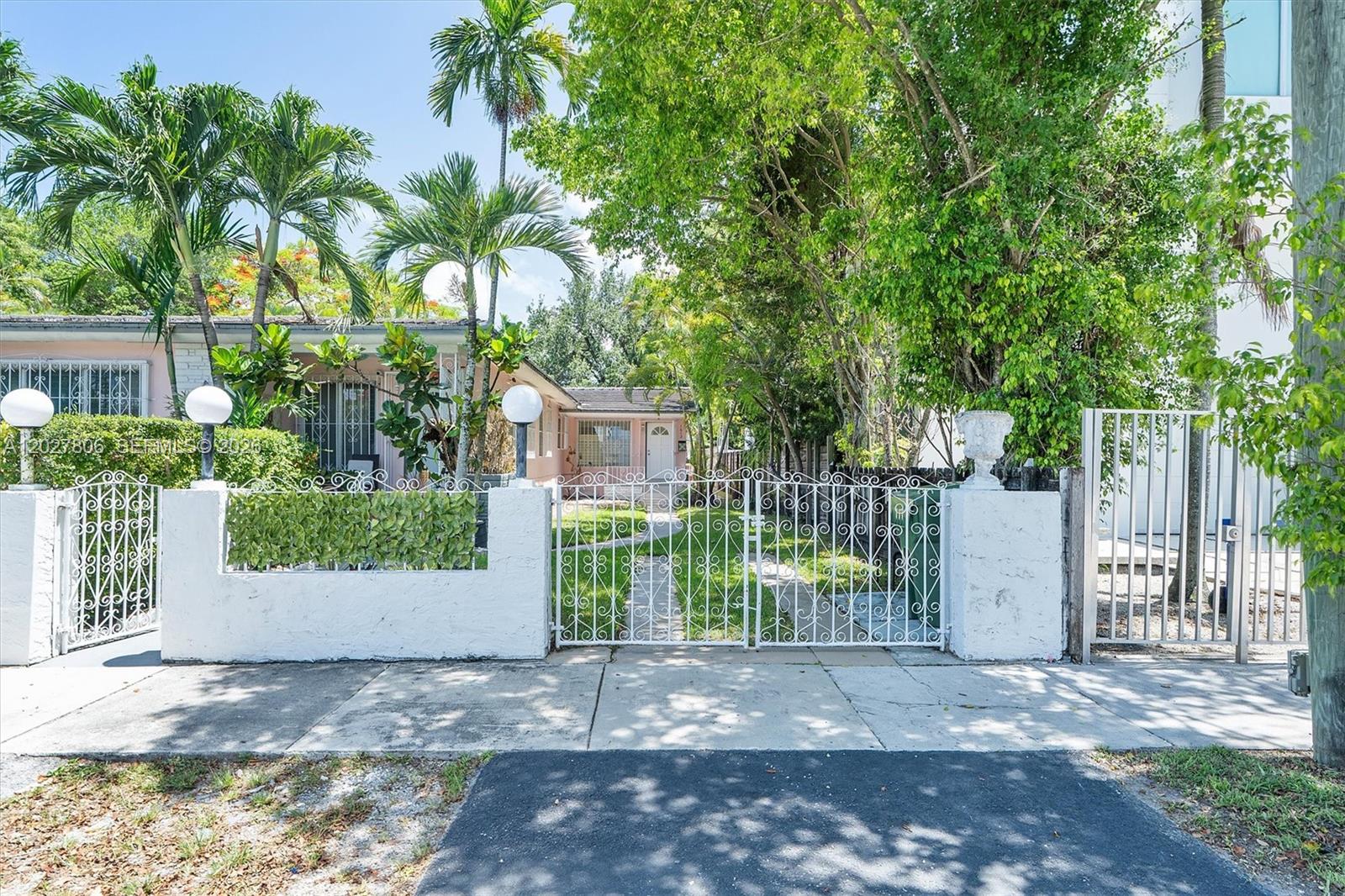 1612 Southwest 23rd Street, Unit 1612 Miami, FL 33145 - Photo 4 of 42 a view of a yard with plants and trees