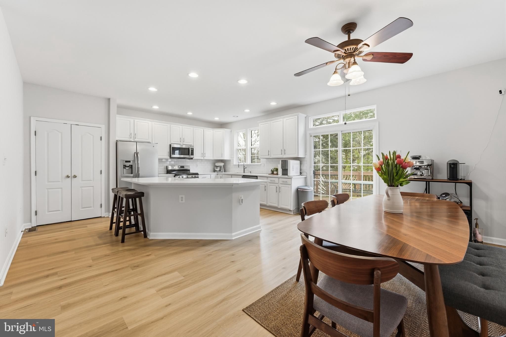 13993 Sawteeth Way Centreville, VA 20121 - Photo 11 of 44 a view of a dining room with furniture and wooden floor