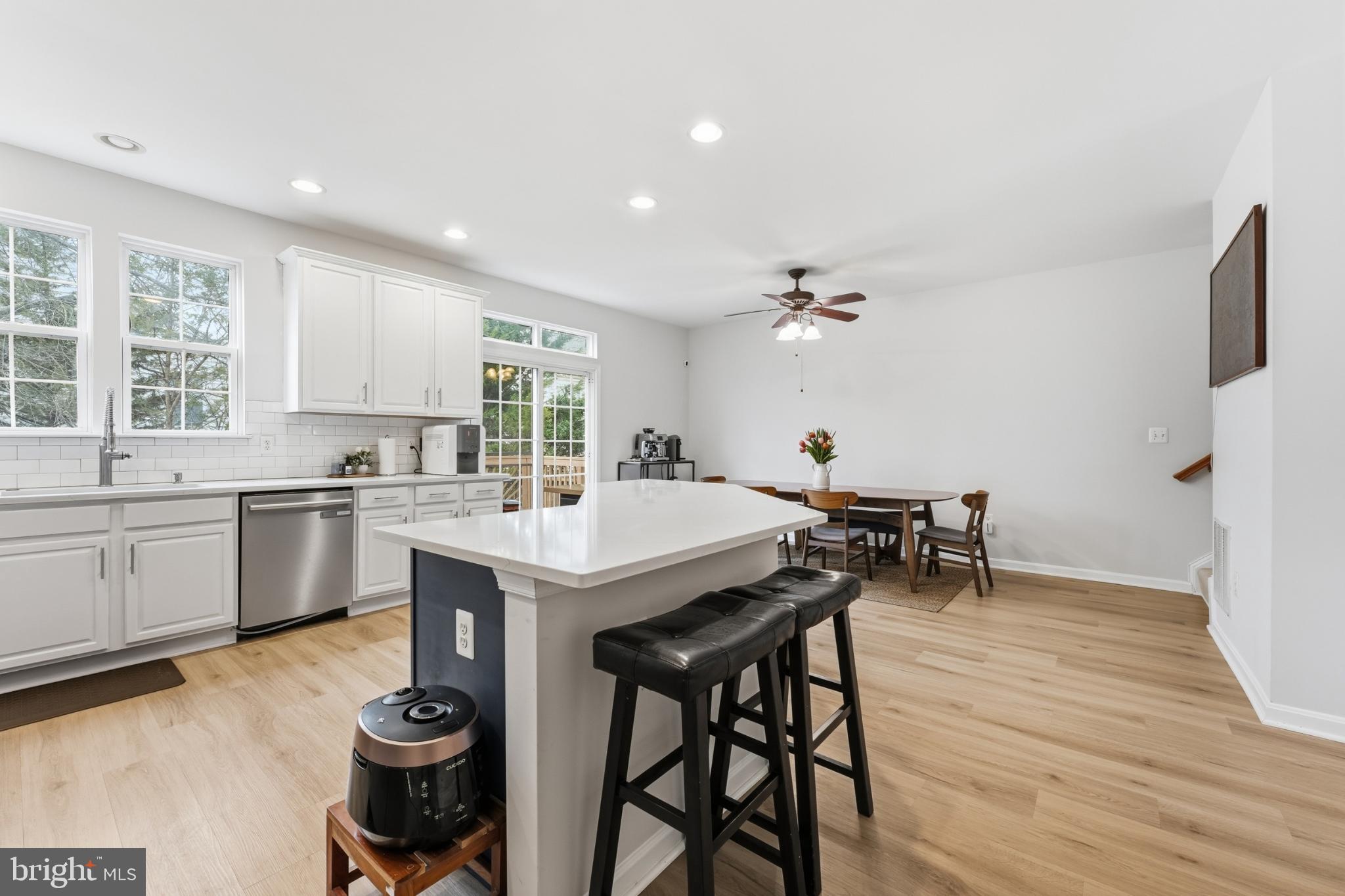 13993 Sawteeth Way Centreville, VA 20121 - Photo 13 of 44 a kitchen with a table and chairs in it