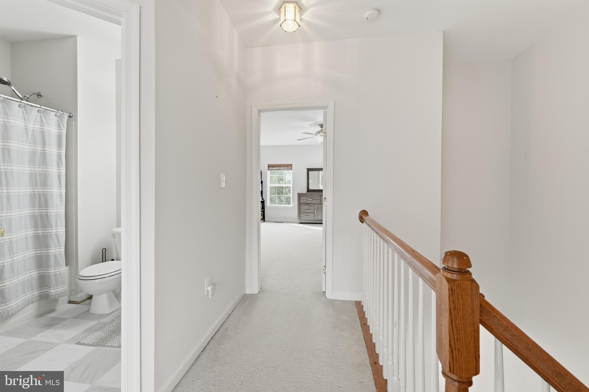 13993 Sawteeth Way Centreville, VA 20121 - Photo 18 of 44 a view of a hallway with white walls and door