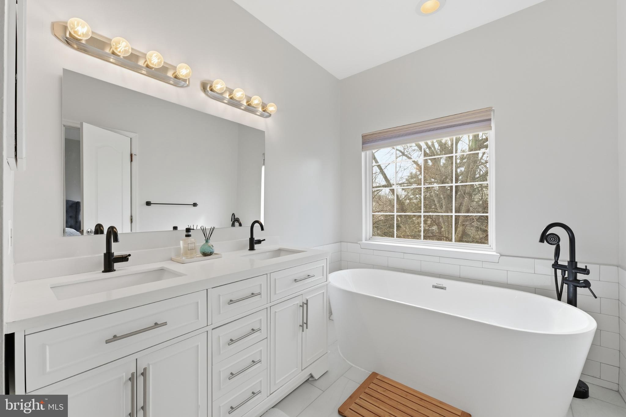 13993 Sawteeth Way Centreville, VA 20121 - Photo 24 of 44 a bathroom with a sink double vanity and a bathtub