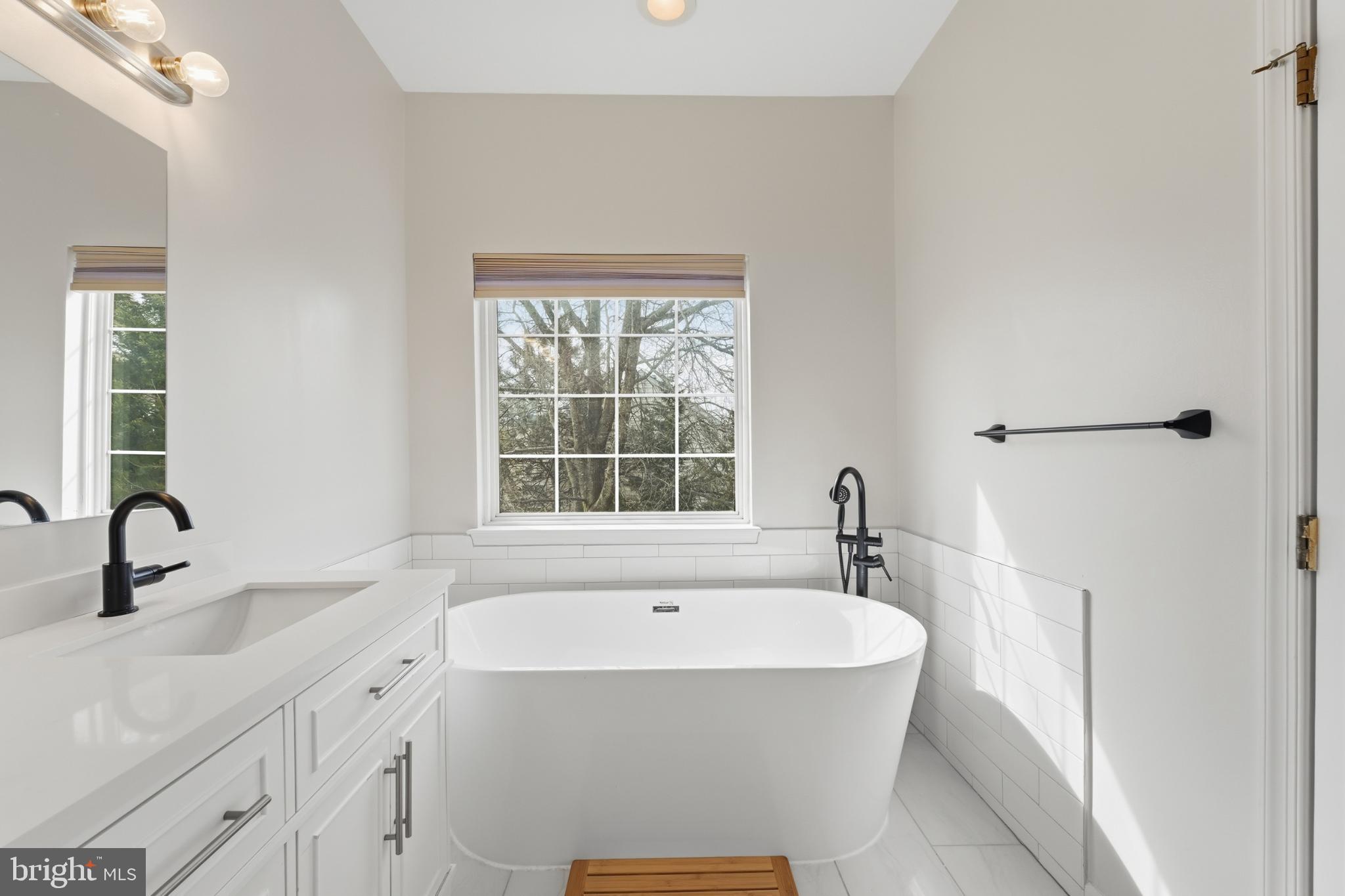 13993 Sawteeth Way Centreville, VA 20121 - Photo 25 of 44 a white bath tub sitting next to a white sink
