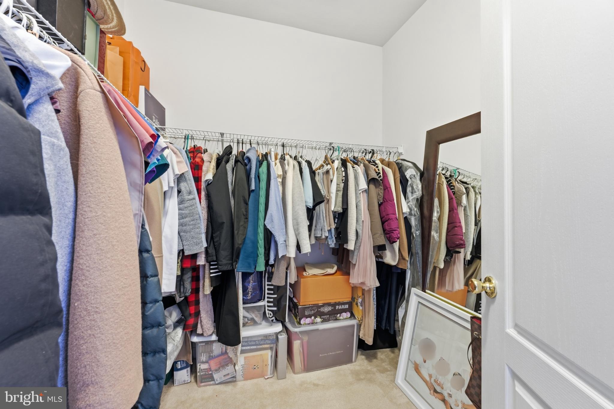 13993 Sawteeth Way Centreville, VA 20121 - Photo 27 of 44 a view of walk in closet with clothes