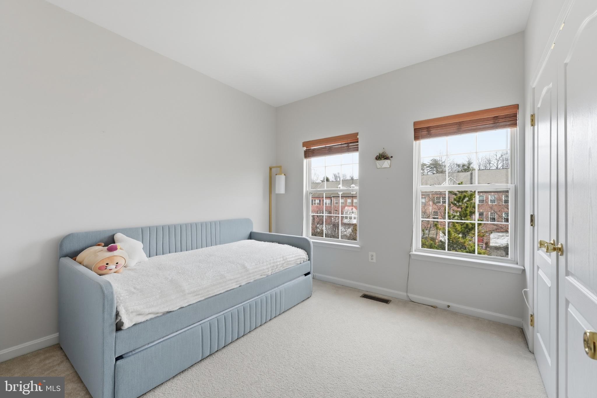 13993 Sawteeth Way Centreville, VA 20121 - Photo 29 of 44 a bedroom with a bed and a window