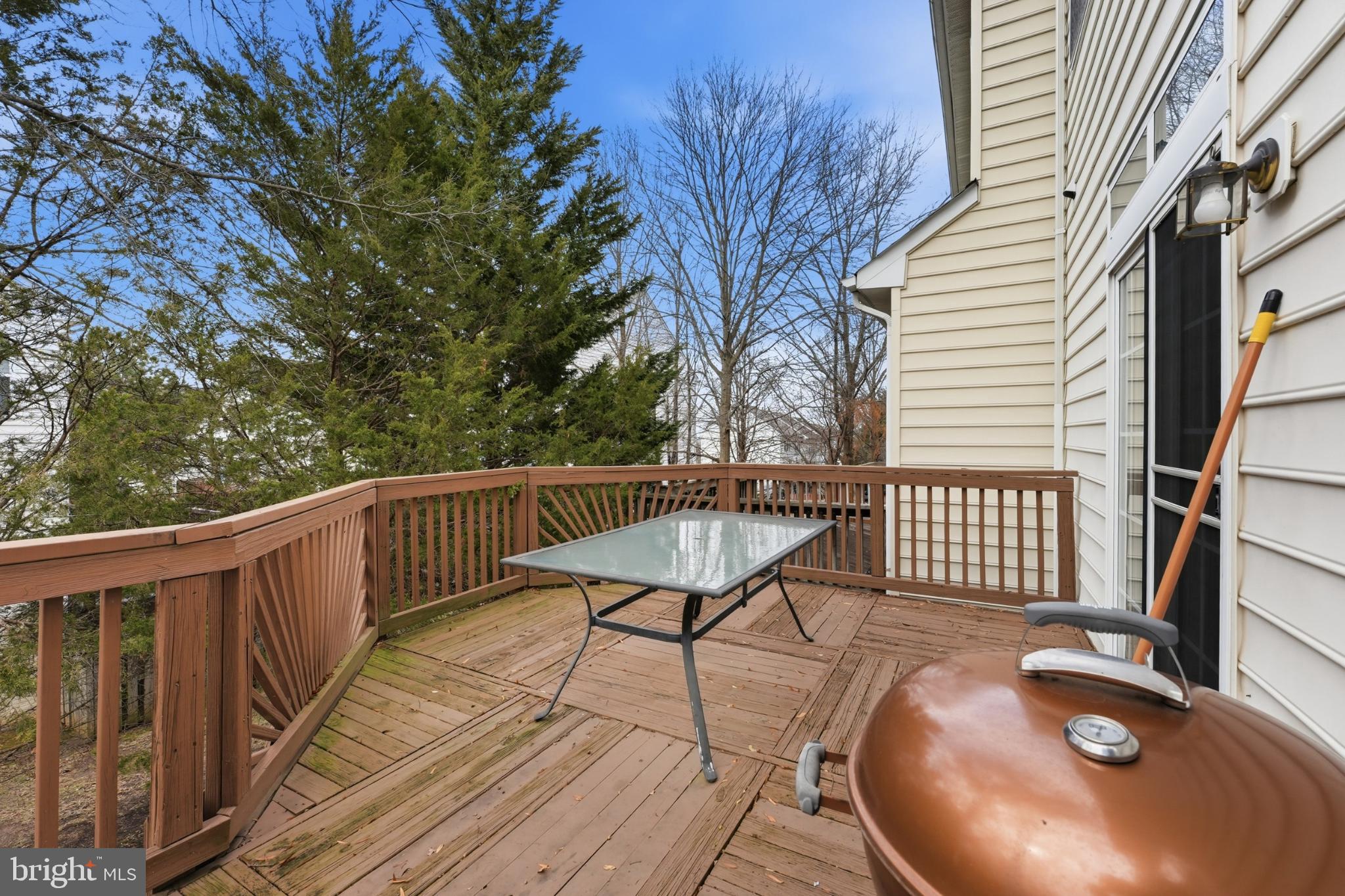 13993 Sawteeth Way Centreville, VA 20121 - Photo 38 of 44 a view of balcony with wooden floor and outdoor seating