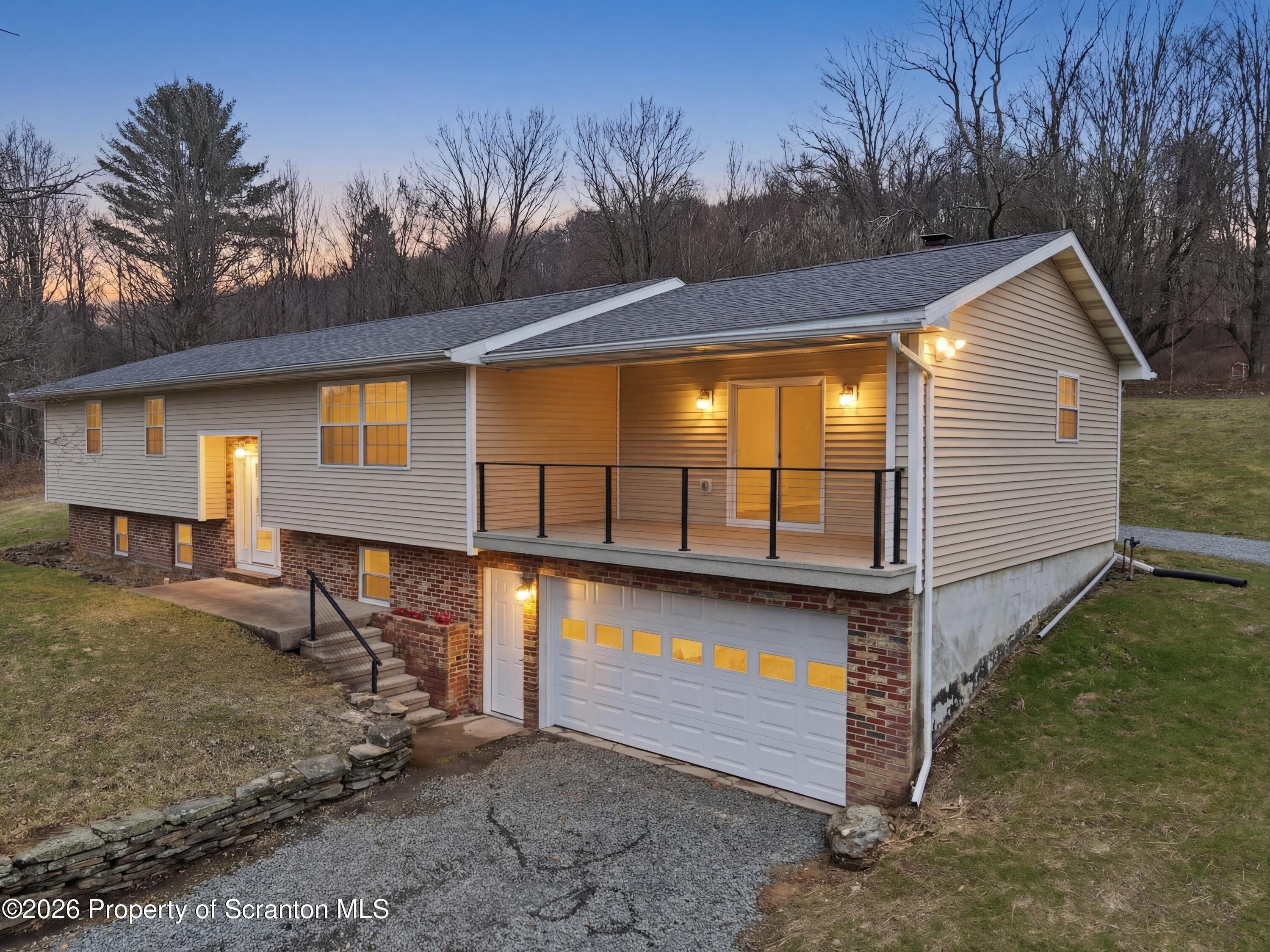 16204 Highway 407 Factoryville, PA 18419 - Photo 1 of 74 a view of a house with backyard and sitting area
