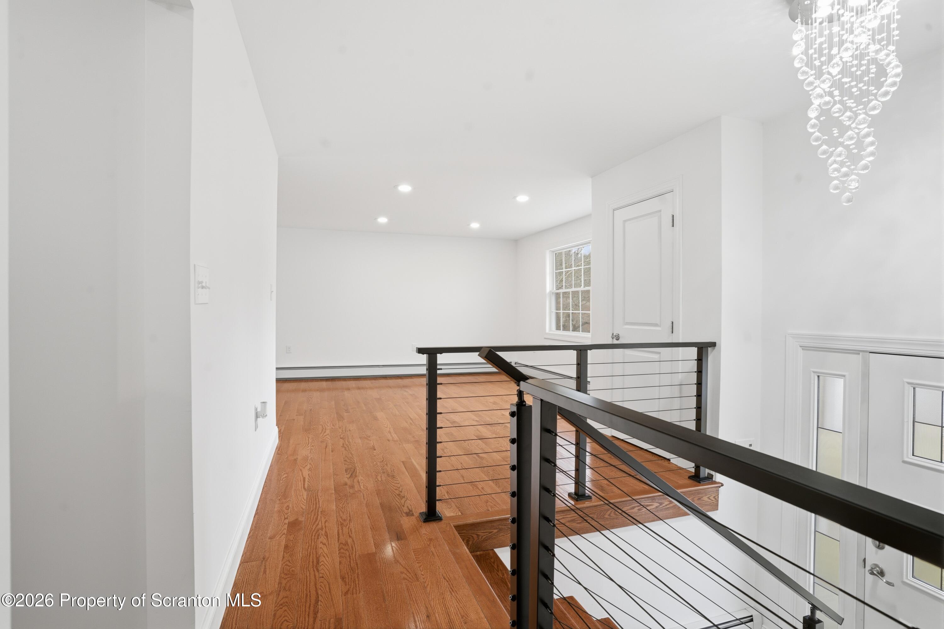 16204 Highway 407 Factoryville, PA 18419 - Photo 13 of 74 a view of entryway with wooden floor