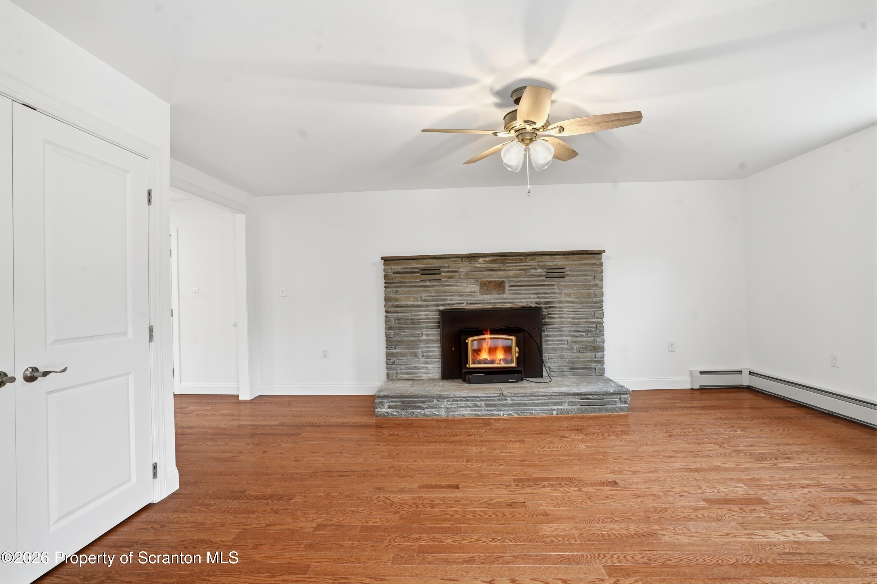 16204 Highway 407 Factoryville, PA 18419 - Photo 25 of 74 a view of an empty room with a fireplace