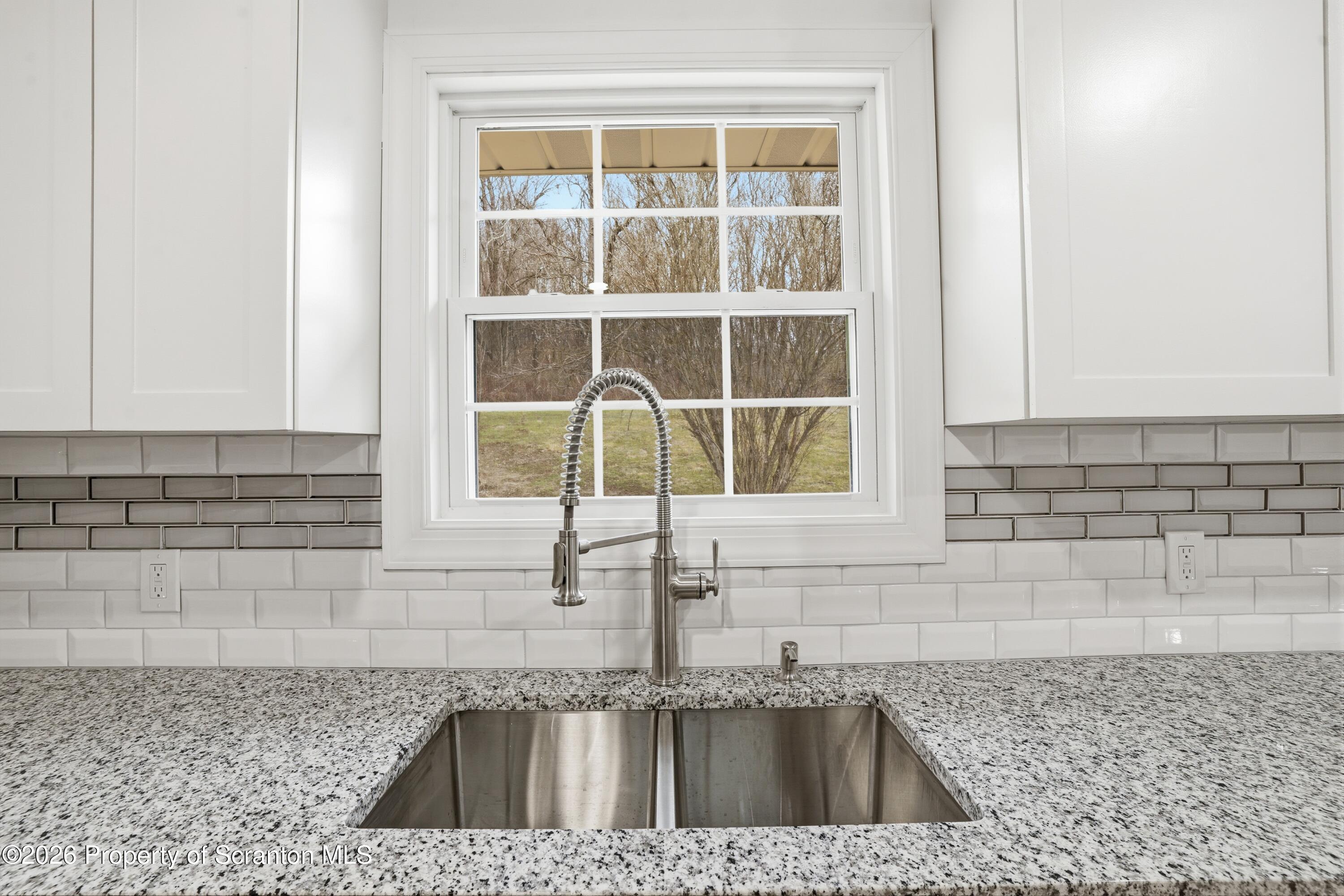 16204 Highway 407 Factoryville, PA 18419 - Photo 37 of 74 a kitchen with a sink and a window