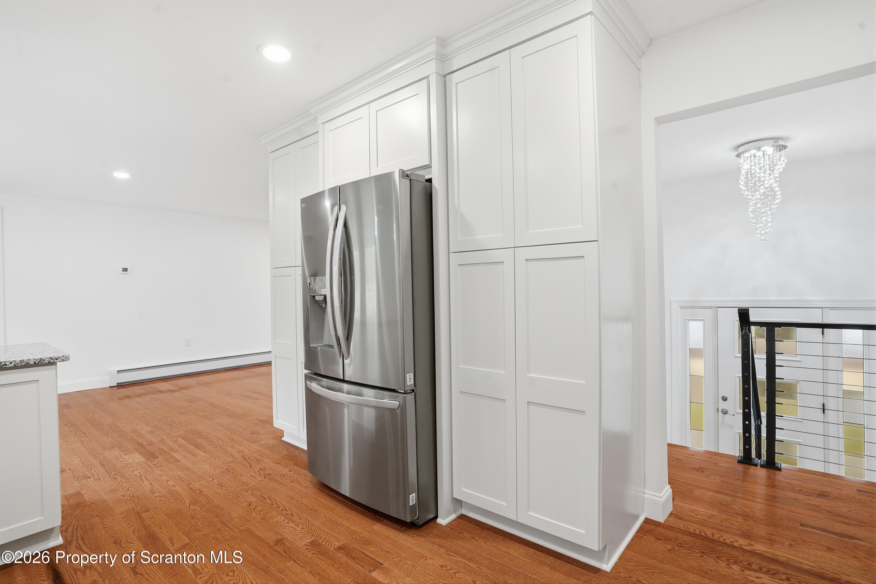 16204 Highway 407 Factoryville, PA 18419 - Photo 42 of 74 a metallic refrigerator freezer sitting in a kitchen