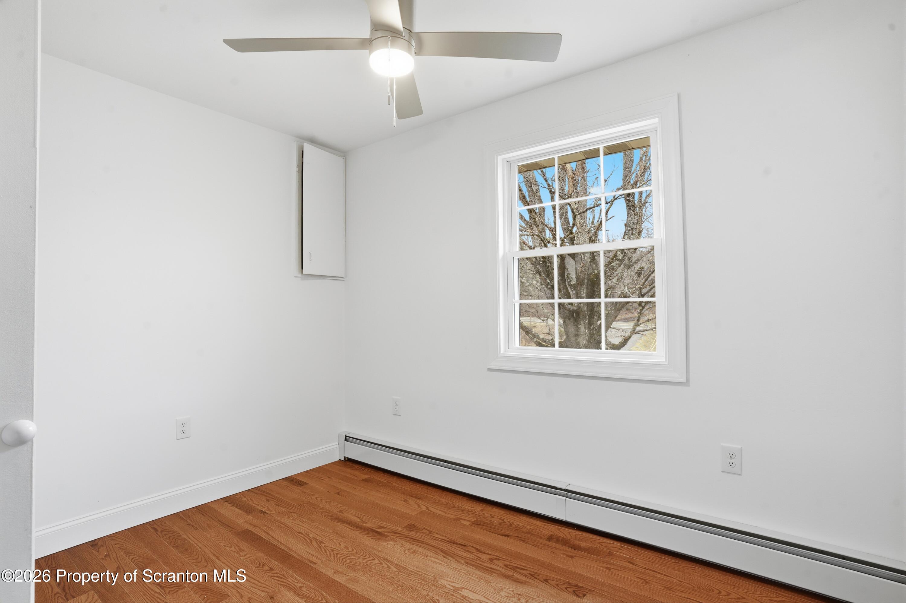 16204 Highway 407 Factoryville, PA 18419 - Photo 46 of 74 an empty room with a window