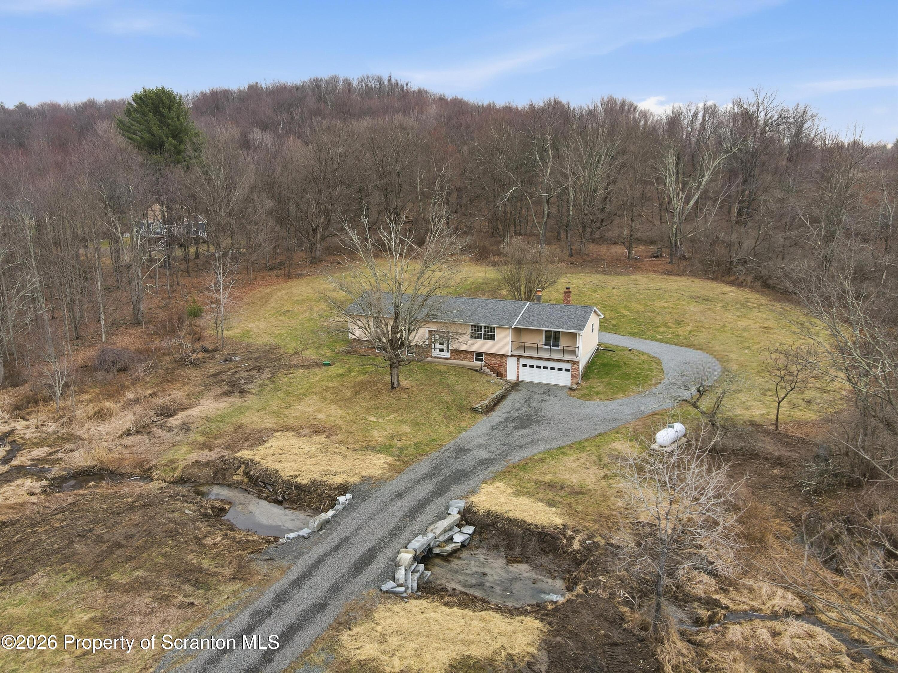 16204 Highway 407 Factoryville, PA 18419 - Photo 5 of 74 a view of a backyard with a small yard