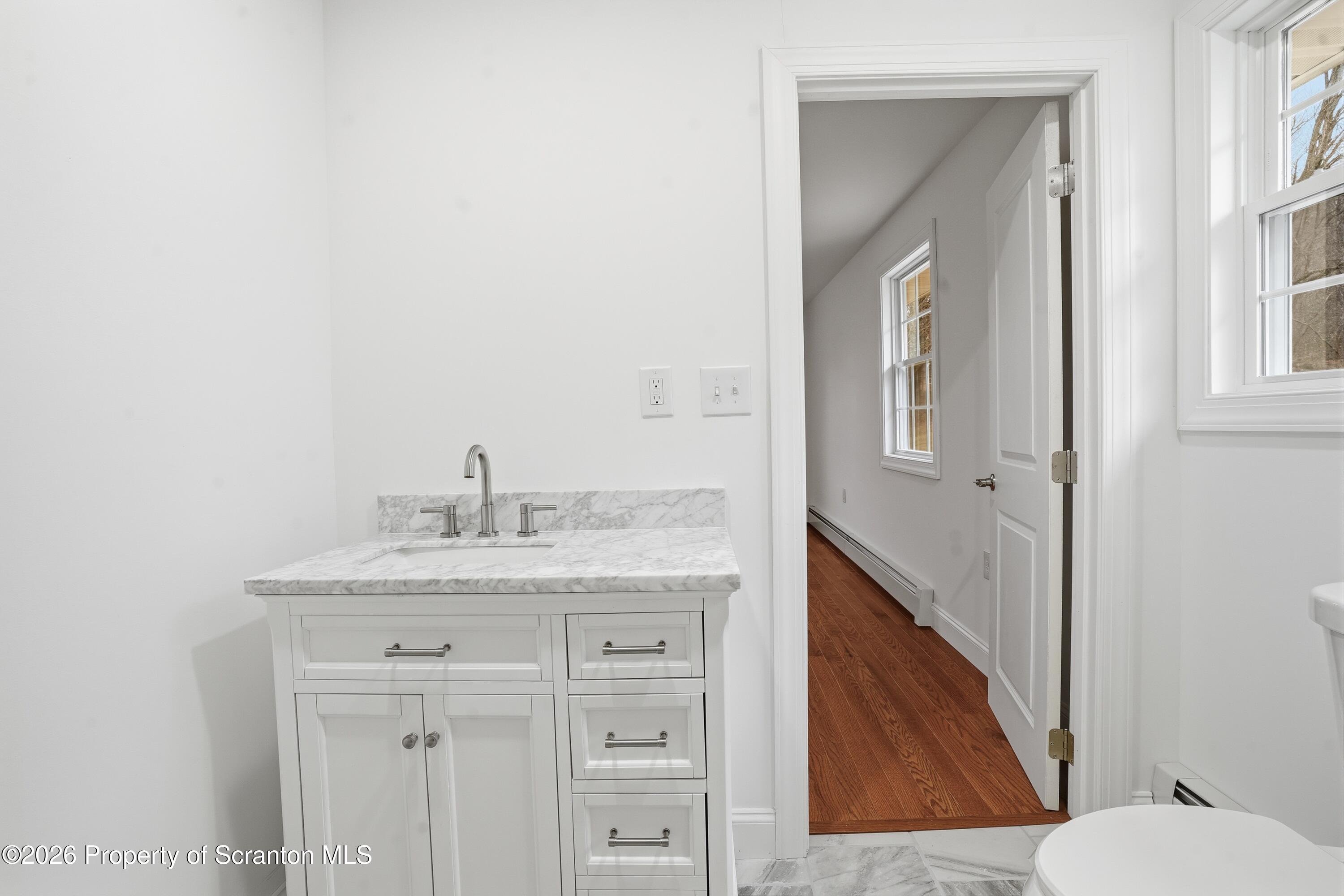 16204 Highway 407 Factoryville, PA 18419 - Photo 52 of 74 a bathroom with a granite countertop sink and a toilet
