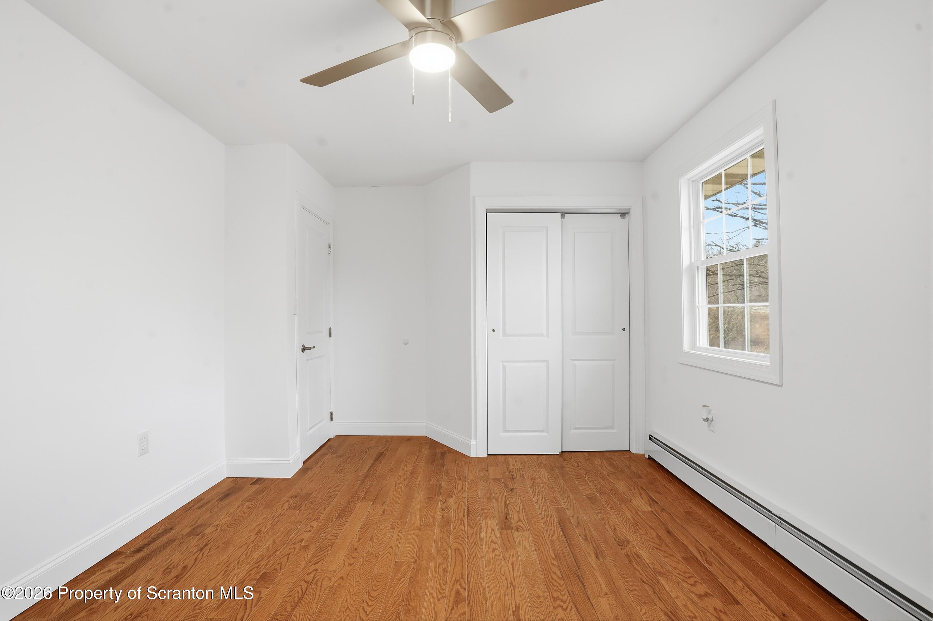 16204 Highway 407 Factoryville, PA 18419 - Photo 56 of 74 a view of empty room with wooden floor