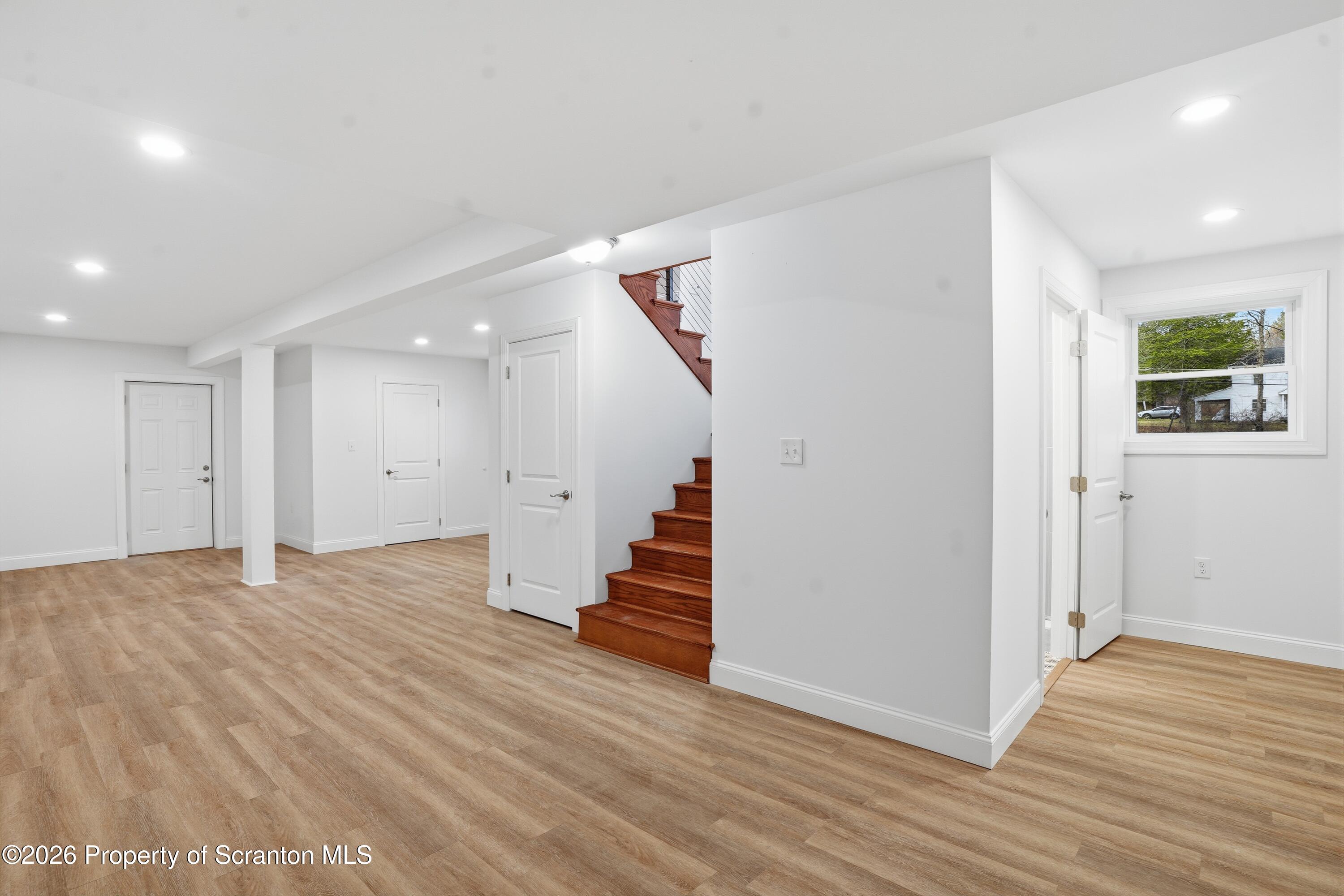 16204 Highway 407 Factoryville, PA 18419 - Photo 58 of 74 a view of a room with wooden floor and staircase