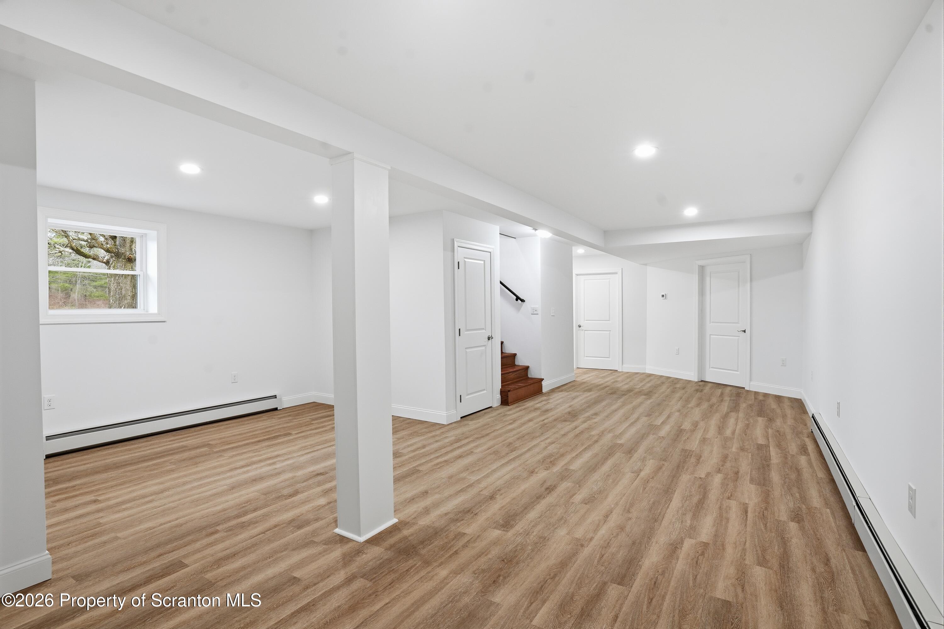 16204 Highway 407 Factoryville, PA 18419 - Photo 60 of 74 a view of an empty room with wooden floor