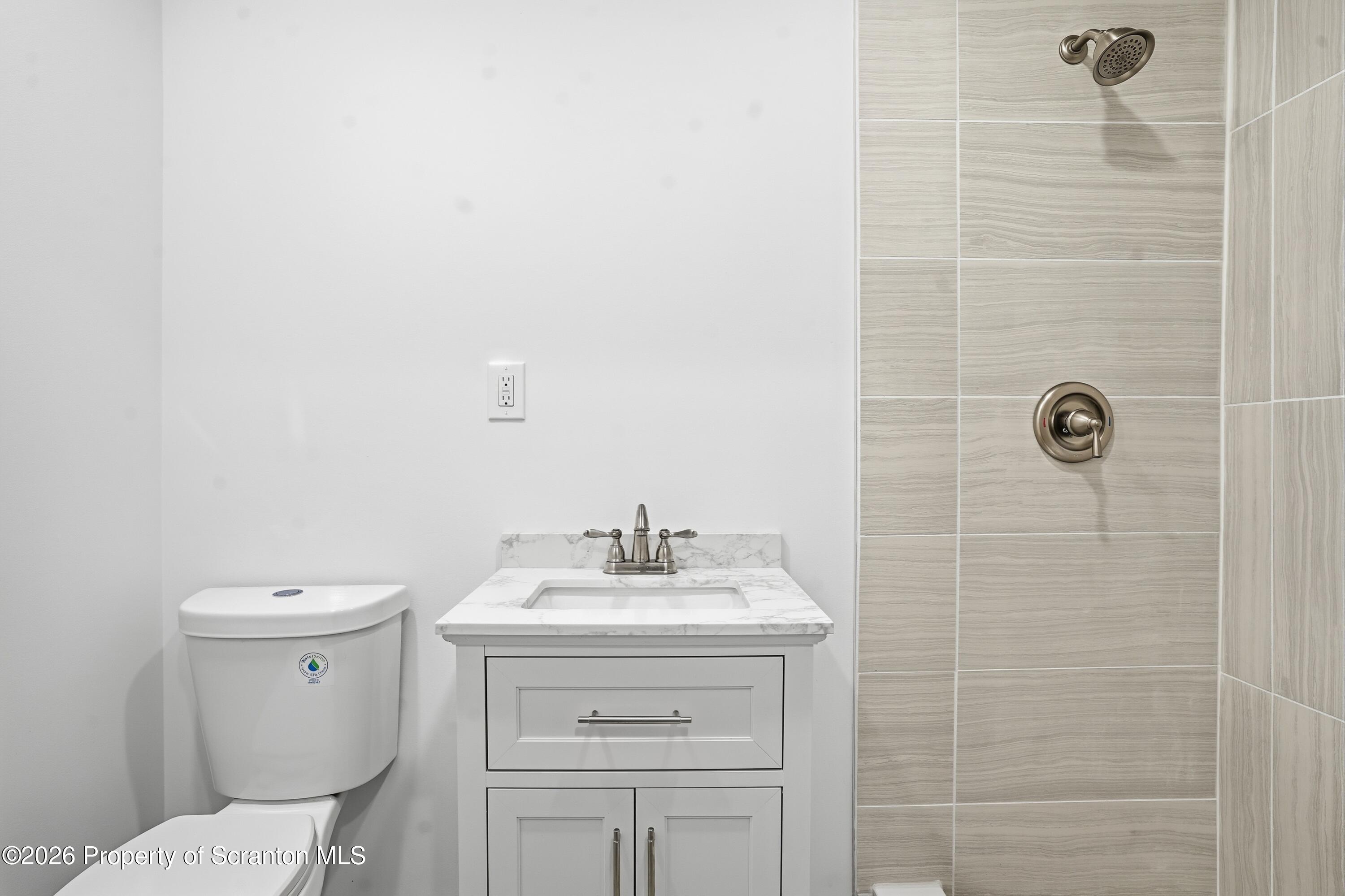 16204 Highway 407 Factoryville, PA 18419 - Photo 63 of 74 a bathroom with a sink toilet and shower