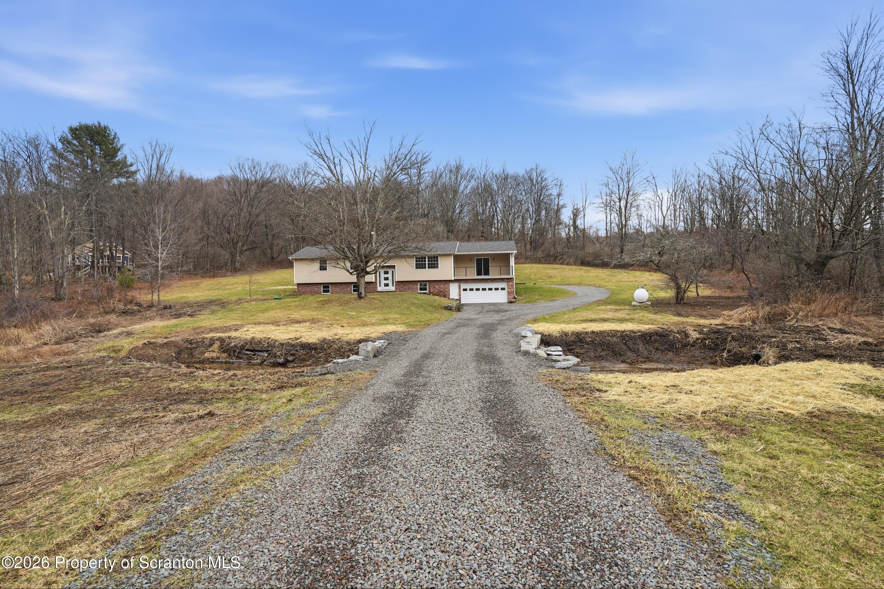 16204 Highway 407 Factoryville, PA 18419 - Photo 7 of 74 a view of a swimming pool with an outdoor space and seating area