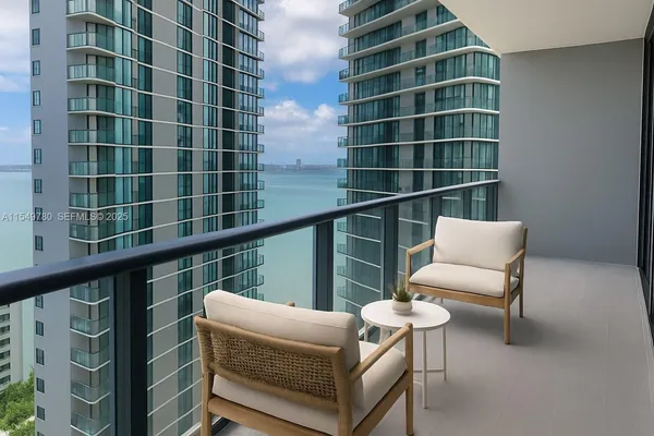a view of a chair and table in the balcony