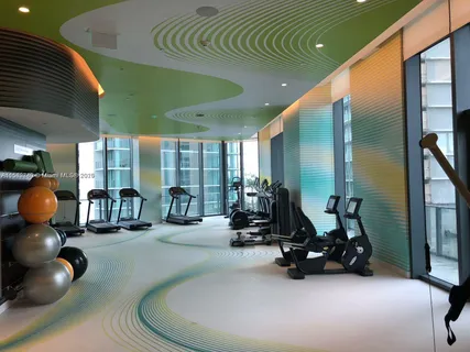 a view of swimming pool with outdoor seating and yard in back