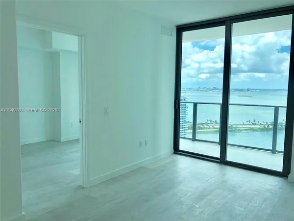 a view of a room with a large window